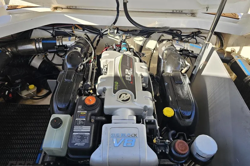 Slide: The Image of Engine compartment of a 2015 Monterey 288SS Super Sport boat, featuring a powerful V8 engine. - 100