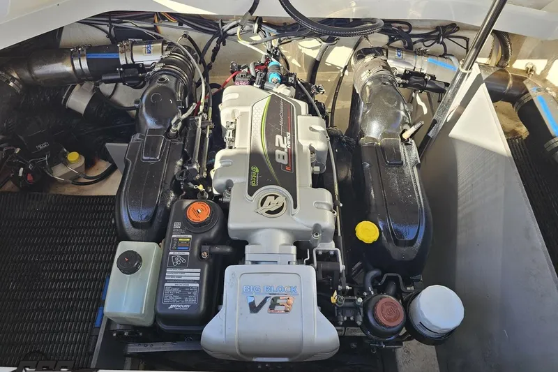 Slide: The Image of Engine compartment of a 2015 Monterey 288SS Super Sport boat, featuring a powerful V8 engine. - 101