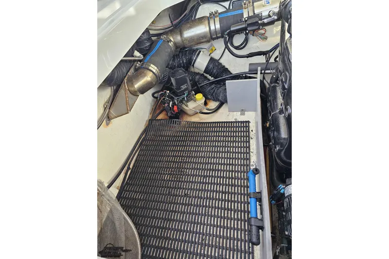 Slide: The Image of Engine compartment of a 2015 Monterey 288SS Super Sport boat, showcasing mechanical components. - 104