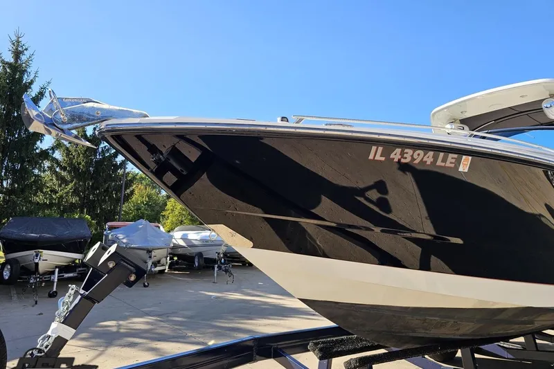 Slide: The Image of 2015 Monterey 288SS Super Sport boat on trailer, sunny day, registration IL 4394 LE. - 13