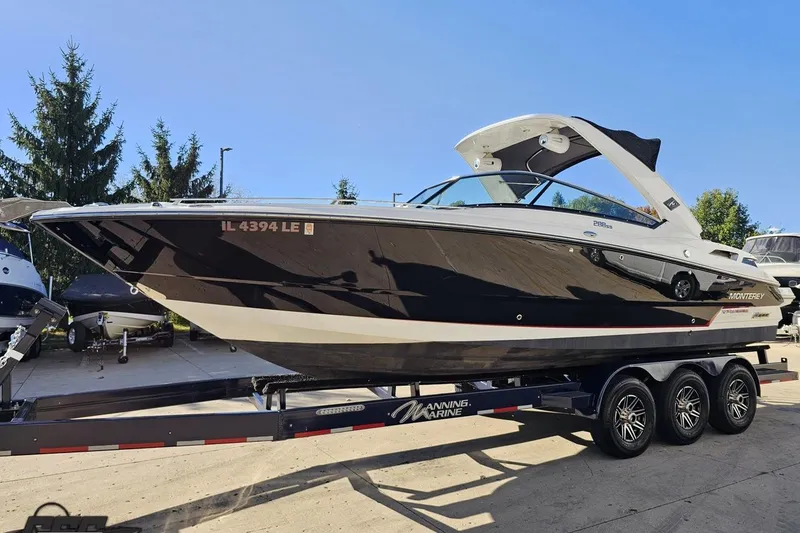 Slide: The Image of 2015 Monterey 288SS Super Sport boat on trailer, parked outdoors. - 14
