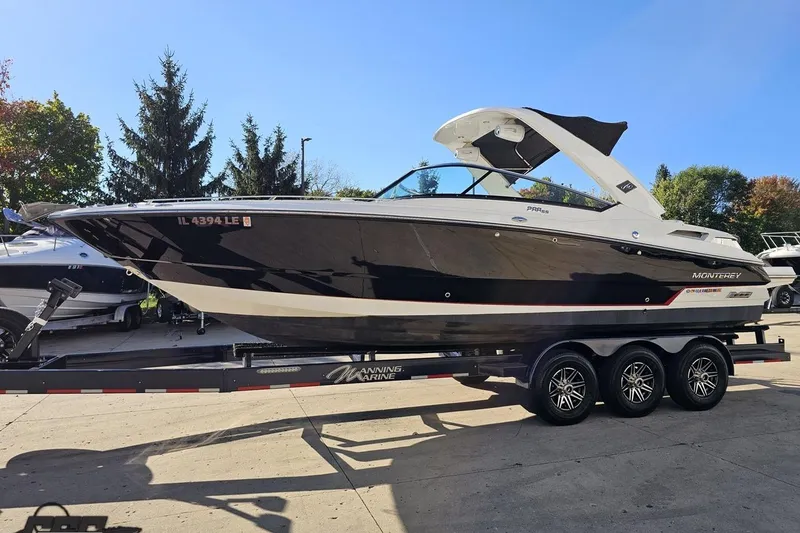 Slide: The Image of 2015 Monterey 288SS Super Sport boat on trailer, parked outdoors. - 15