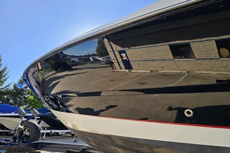 Slide: The Image of 2015 Monterey 288SS Super Sport boat with sleek black hull reflecting surroundings. - 17