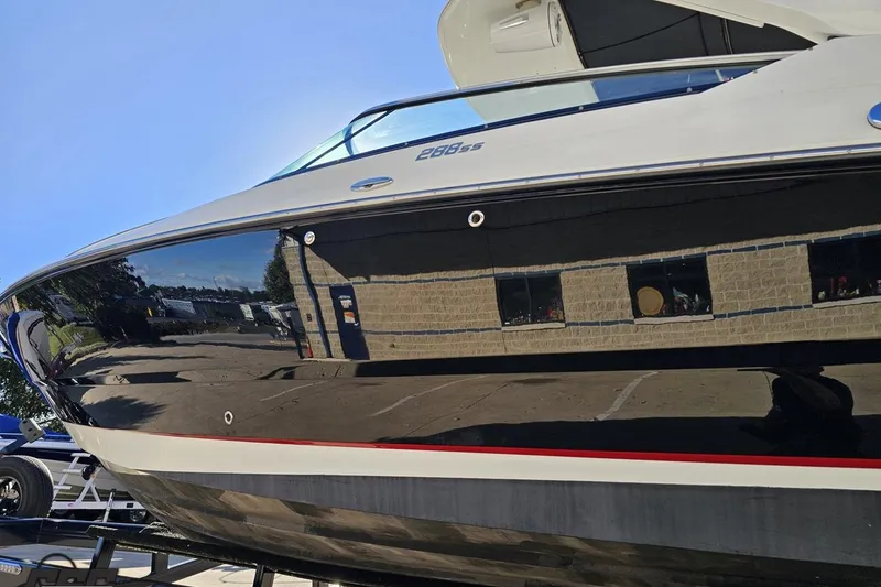 Slide: The Image of 2015 Monterey 288SS Super Sport boat with sleek black hull and modern design. - 18