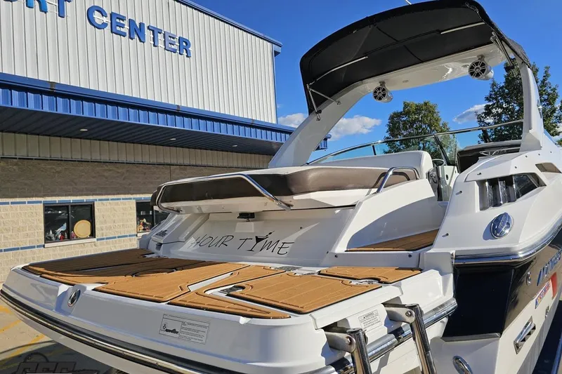 Slide: The Image of 2015 Monterey 288SS Super Sport boat at a marine center, showcasing sleek design. - 26