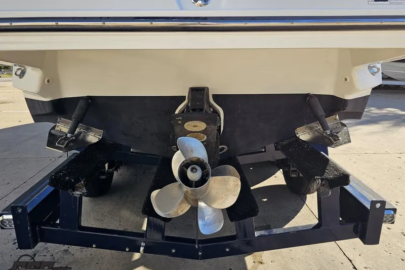 Slide: The Image of 2015 Monterey 288SS Super Sport boat on trailer, showing propeller and stern details. - 28