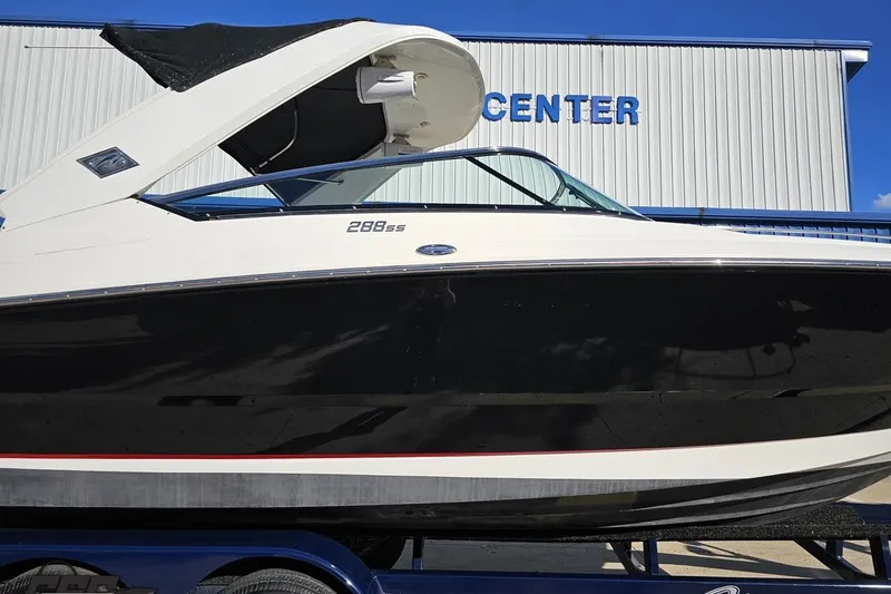 Slide: The Image of 2015 Monterey 288SS Super Sport boat displayed at a marine center. - 3