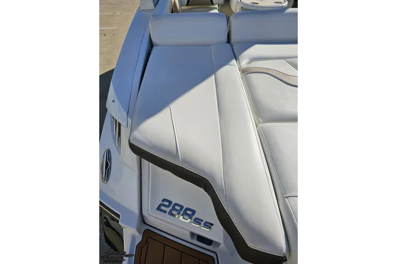 Slide: The Image of 2015 Monterey 288SS Super Sport boat with white cushioned seating and logo detail. - 35