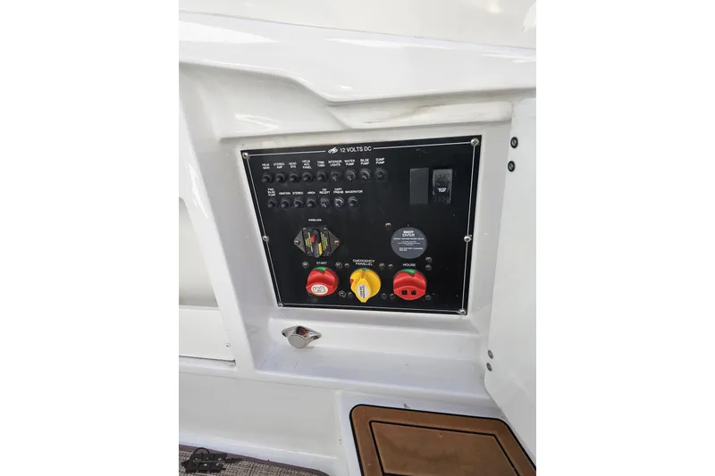 Slide: The Image of Control panel of a 2015 Monterey 288SS Super Sport boat, featuring switches and dials. - 41