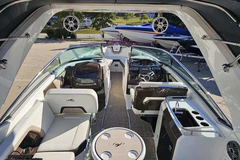 Slide: The Image of Interior of a 2015 Monterey 288SS Super Sport boat, featuring luxurious seating and modern amenities. - 43