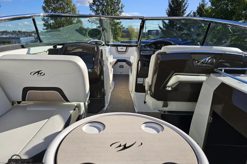 Slide: The Image of Interior of a 2015 Monterey 288SS Super Sport boat with seating and dashboard. - 46