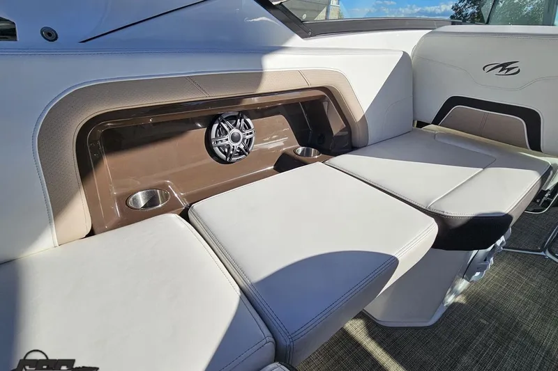 Slide: The Image of Interior seating of 2015 Monterey 288SS Super Sport boat with speaker and cup holders. - 48