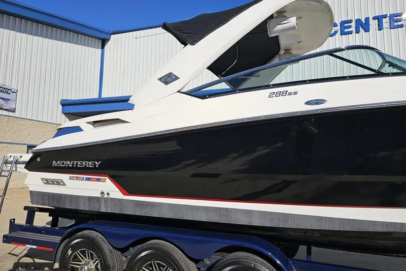 Slide: The Image of 2015 Monterey 288SS Super Sport boat on trailer, side view, outdoors. - 5