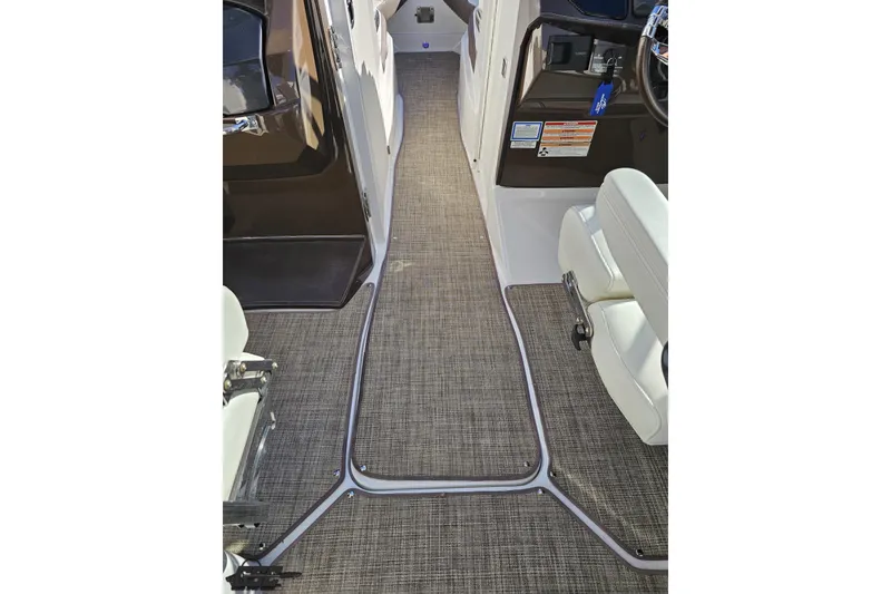 Slide: The Image of Interior view of 2015 Monterey 288SS Super Sport boat with carpeted flooring and seating. - 50