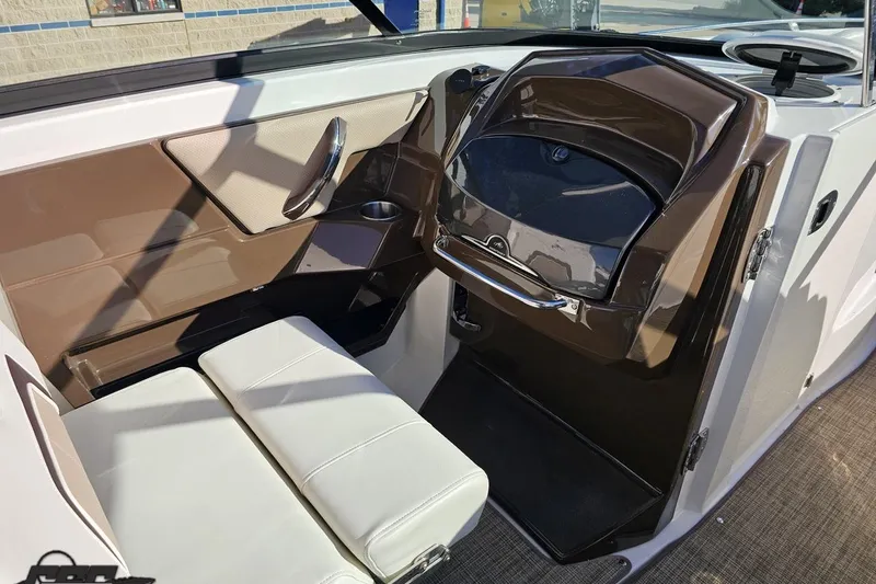 Slide: The Image of Interior of 2015 Monterey 288SS Super Sport boat with brown and white seating. - 58