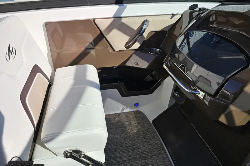 Slide: The Image of Interior of a 2015 Monterey 288SS Super Sport boat, featuring white seating and sleek design. - 59