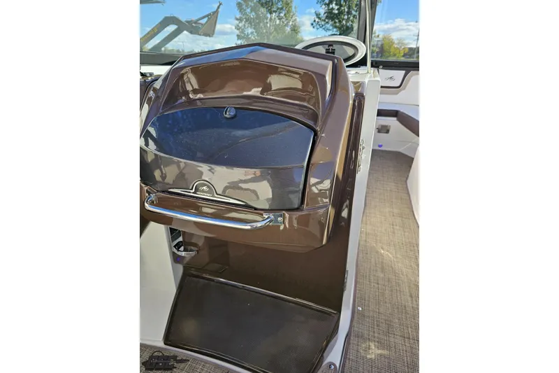 Slide: The Image of 2015 Monterey 288SS Super Sport boat interior with brown dashboard and steering wheel. - 61