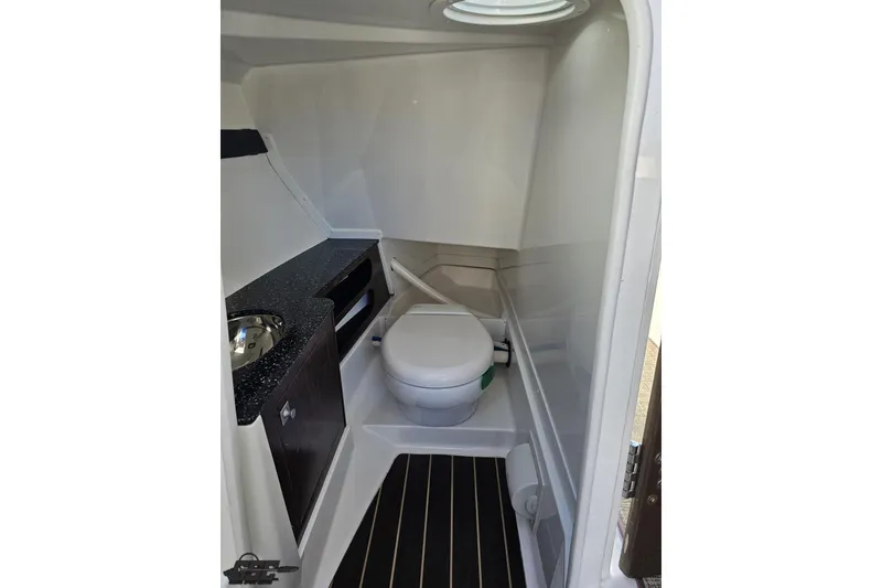 Slide: The Image of 2015 Monterey 288SS Super Sport boat interior bathroom with toilet and sink. - 64