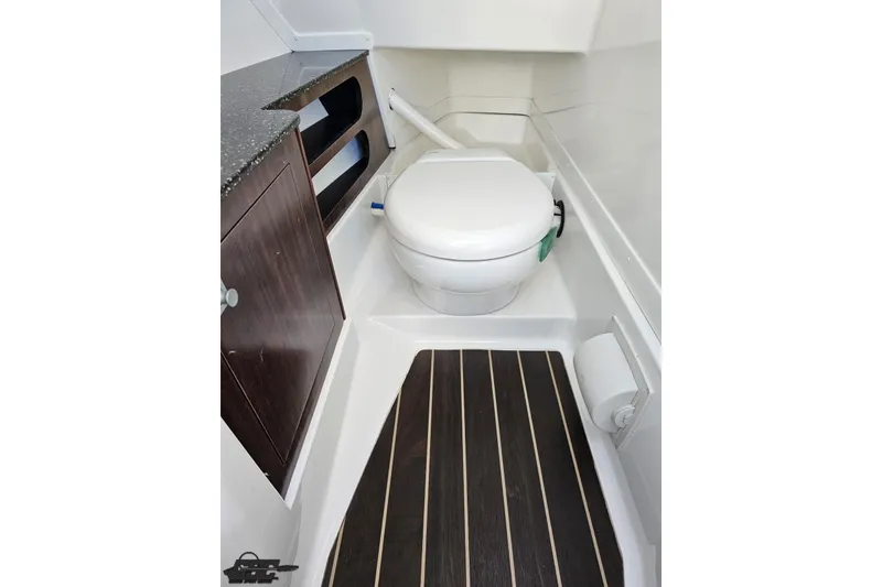 Slide: The Image of 2015 Monterey 288SS Super Sport boat bathroom with modern fixtures and wood accents. - 65