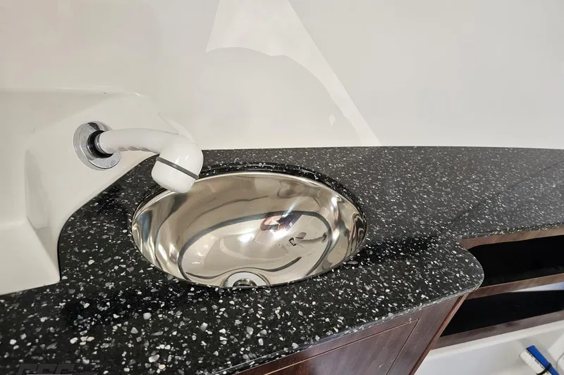Slide: The Image of 2015 Monterey 288SS Super Sport boat sink with speckled countertop. - 66