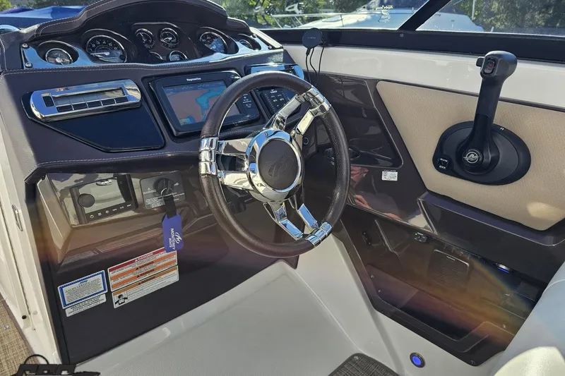 Slide: The Image of 2015 Monterey 288SS Super Sport boat dashboard with steering wheel and control panel. - 67