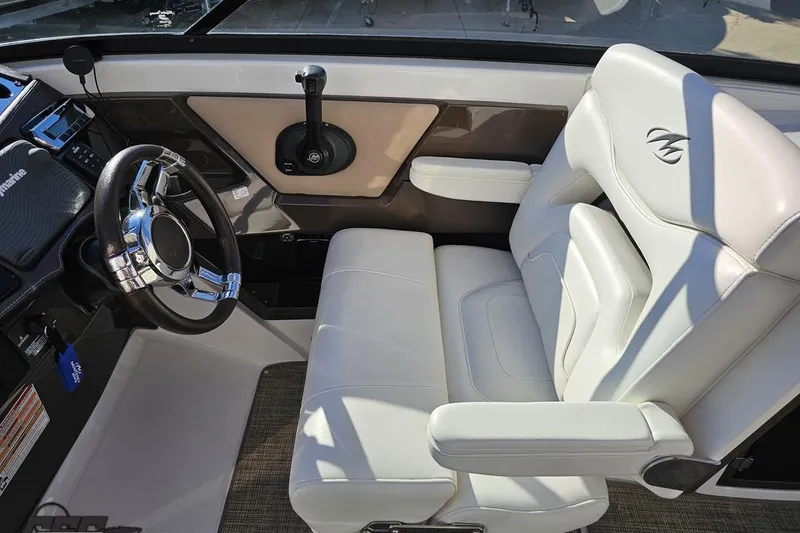 Slide: The Image of Interior of 2015 Monterey 288SS Super Sport boat with white leather seating and steering wheel. - 68