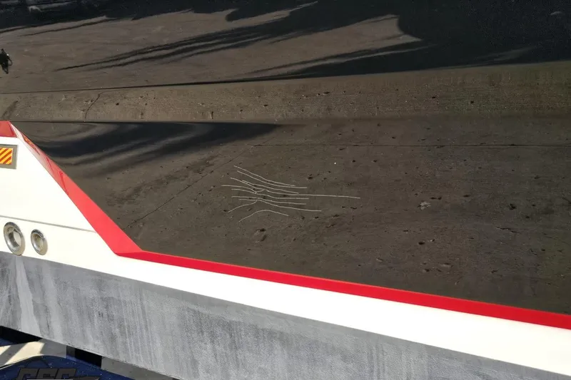 Slide: The Image of 2015 Monterey 288SS Super Sport boat with visible scratches on the hull. - 7