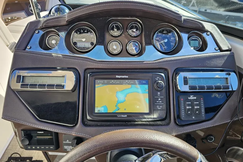 Slide: The Image of Dashboard of a 2015 Monterey 288SS Super Sport boat with navigation system and gauges. - 71