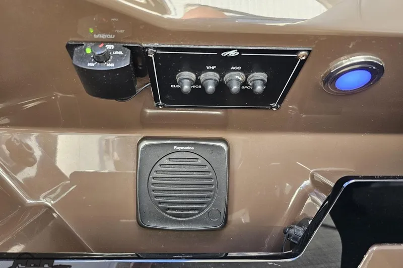 Slide: The Image of Control panel of a 2015 Monterey 288SS Super Sport boat with switches and speaker. - 77