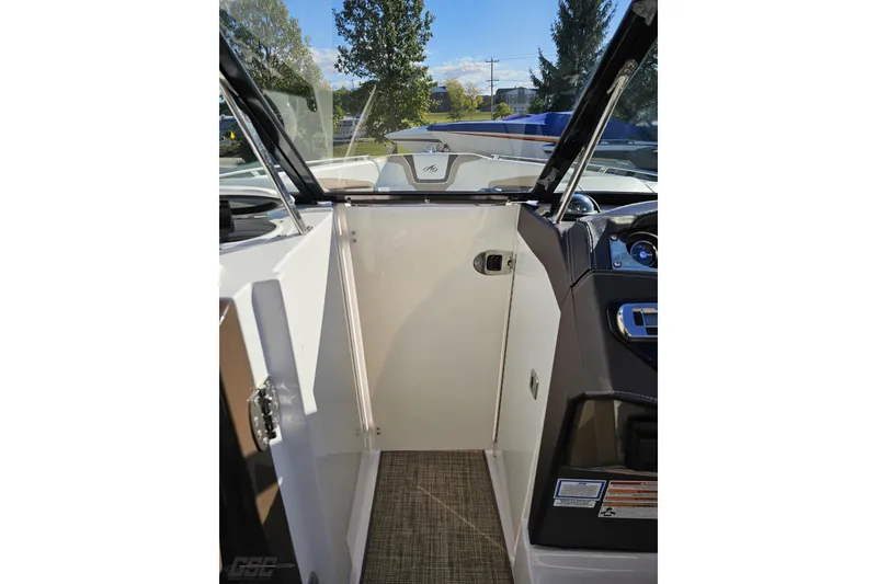 Slide: The Image of 2015 Monterey 288SS Super Sport boat interior with open door and dashboard view. - 78