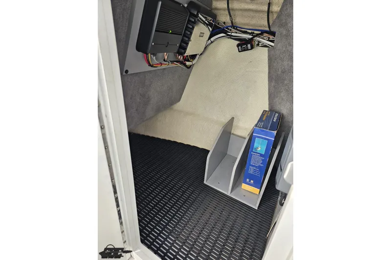 Slide: The Image of Interior view of a 2015 Monterey 288SS Super Sport boat with wiring and storage. - 80