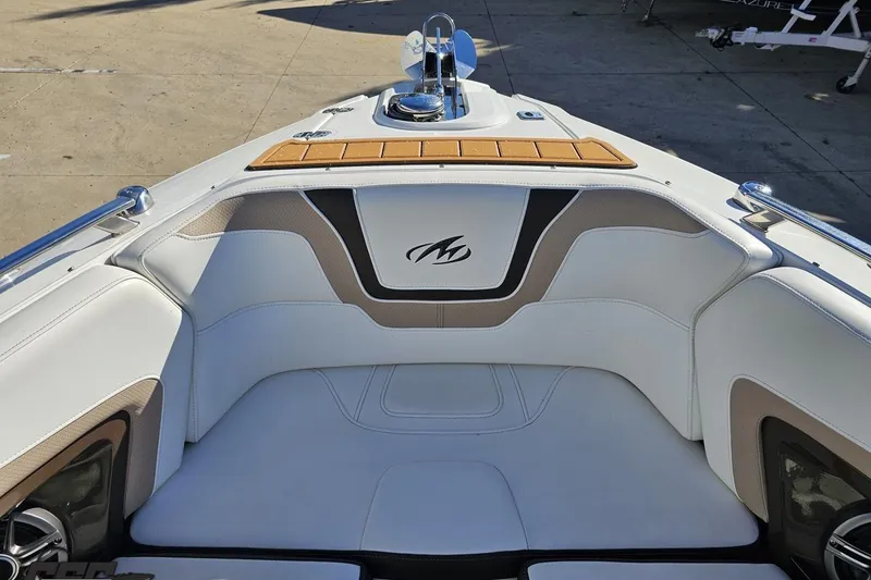 Slide: The Image of 2015 Monterey 288SS Super Sport boat interior with cushioned seating and sleek design. - 86