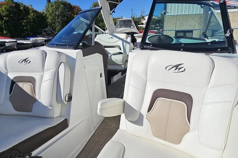 Slide: The Image of 2015 Monterey 288SS Super Sport boat interior with white and beige seating. - 89