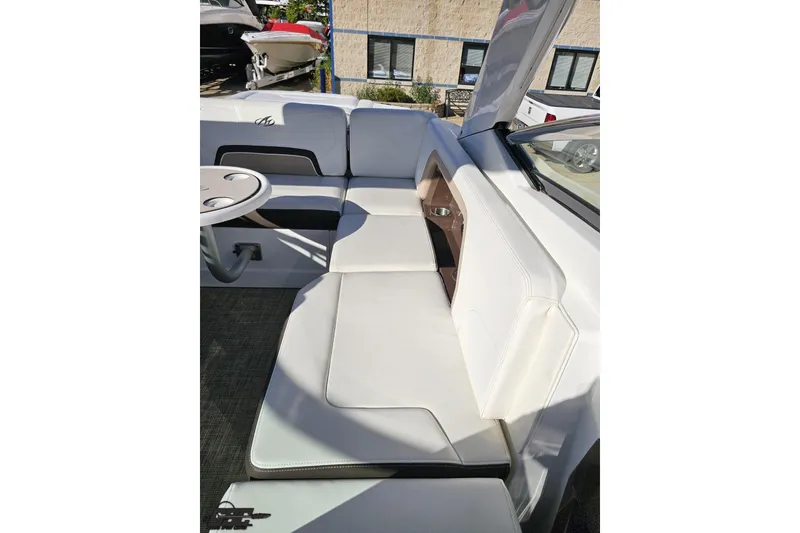 Slide: The Image of 2015 Monterey 288SS Super Sport boat interior with white seating and table. - 95