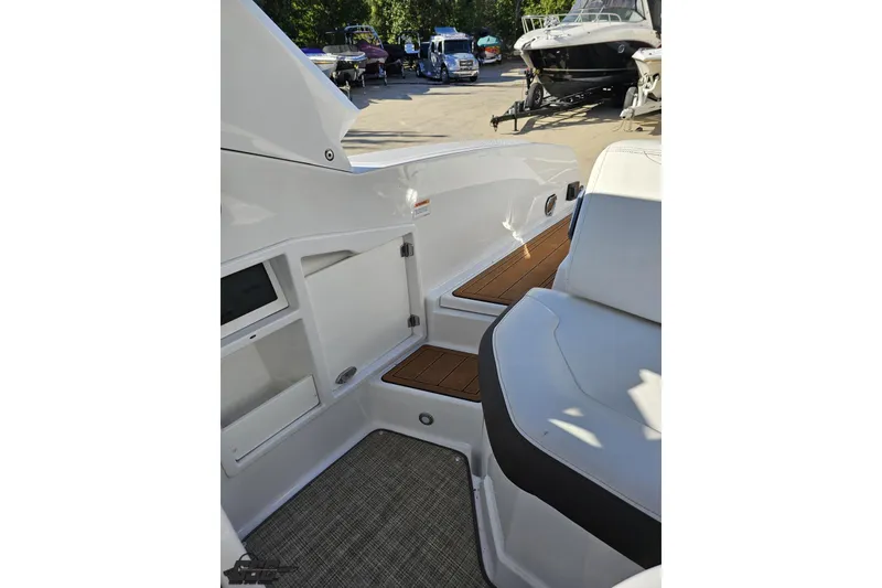 Slide: The Image of 2015 Monterey 288SS Super Sport boat interior with seating and storage compartments. - 98