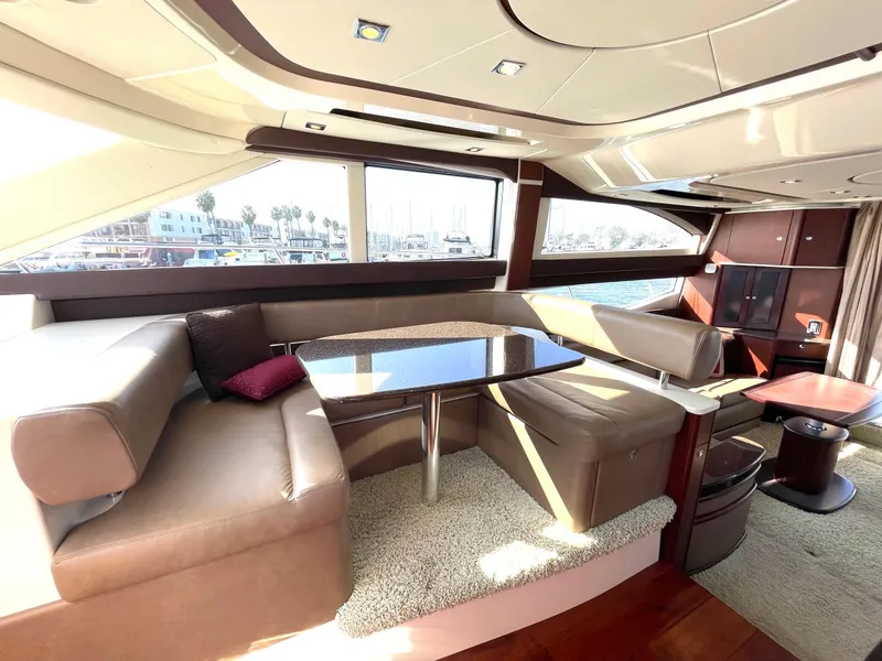 Slide: The Image of Luxurious interior of a 2012 Meridian 441 Sedan yacht with plush seating and elegant table. - 10