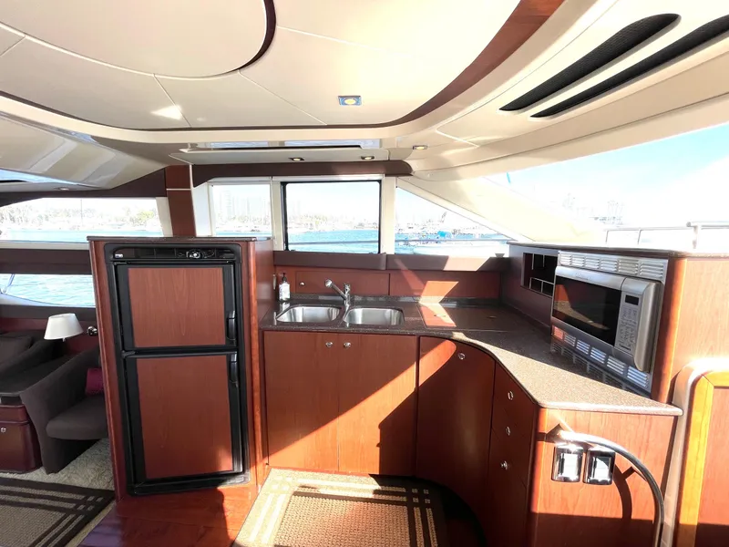 Slide: The Image of Interior of 2012 Meridian 441 Sedan yacht with modern kitchen amenities. - 12