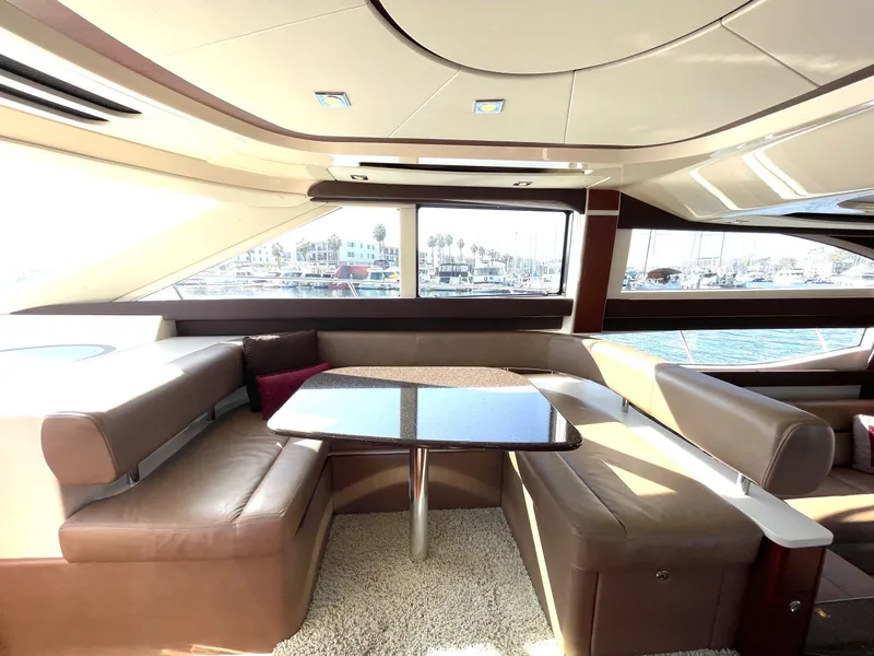 Slide: The Image of Luxurious interior of a 2012 Meridian 441 Sedan yacht with plush seating and panoramic windows. - 15