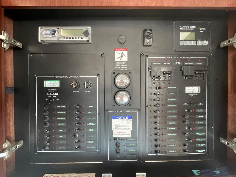 Slide: The Image of Electrical control panel of a 2012 Meridian 441 Sedan yacht, featuring various switches and gauges. - 18