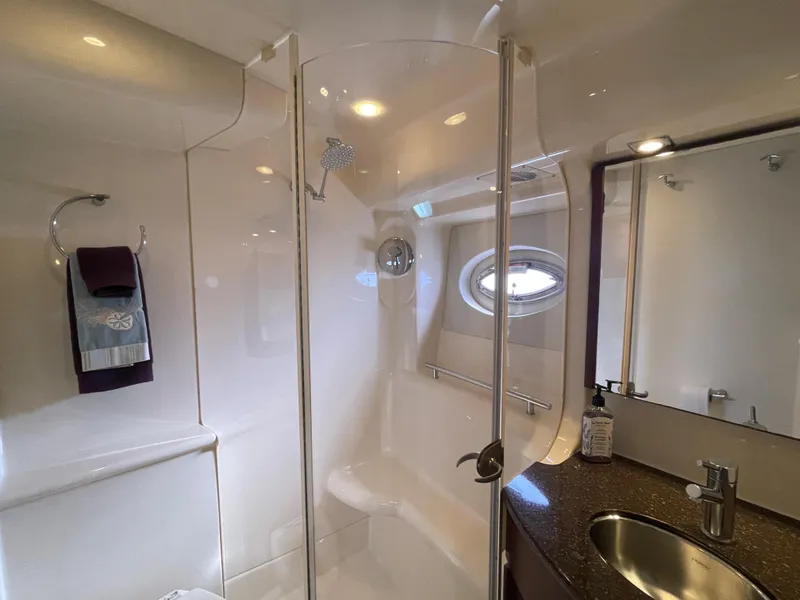 Slide: The Image of Luxurious bathroom in 2012 Meridian 441 Sedan yacht with shower and sink. - 27