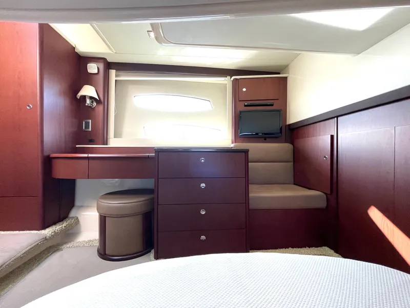 Slide: The Image of Luxurious interior of a 2012 Meridian 441 Sedan yacht with elegant wood finishes. - 28