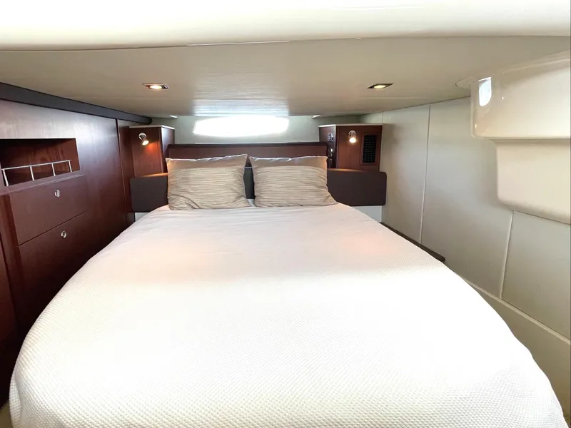 Slide: The Image of Luxurious bedroom interior of 2012 Meridian 441 Sedan yacht with cozy bedding. - 29