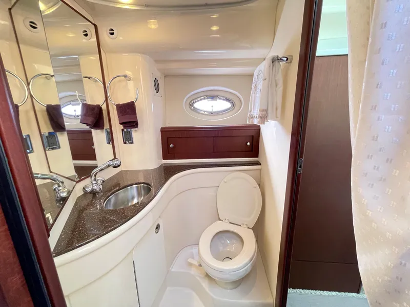Slide: The Image of Luxurious bathroom in 2012 Meridian 441 Sedan yacht with modern fixtures and porthole window. - 31