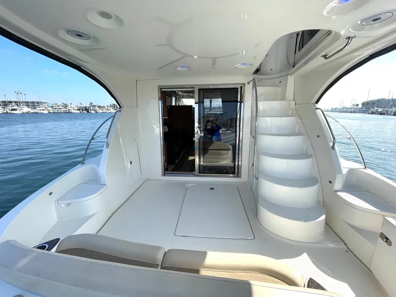 Slide: The Image of Luxurious 2012 Meridian 441 Sedan yacht interior with elegant seating and scenic marina view. - 34
