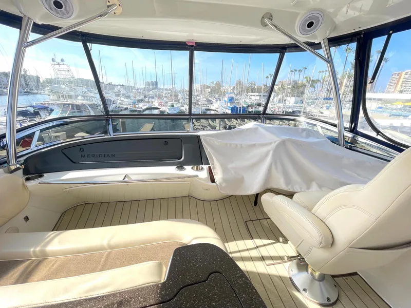 Slide: The Image of 2012 Meridian 441 Sedan interior with marina view, featuring luxurious seating and panoramic windows. - 37