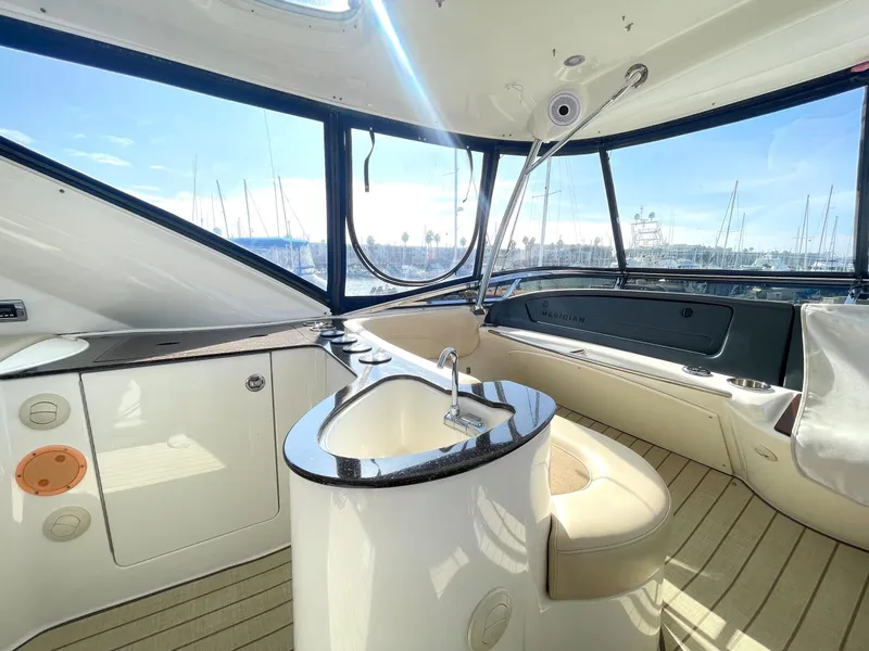Slide: The Image of Interior of 2012 Meridian 441 Sedan yacht with sleek design and panoramic windows. - 40