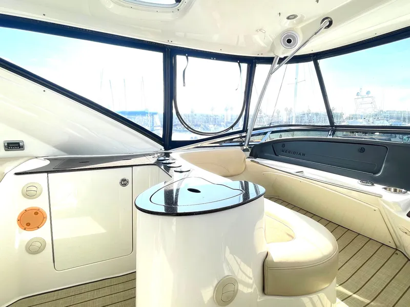 Slide: The Image of Luxurious interior of 2012 Meridian 441 Sedan yacht with elegant seating and panoramic windows. - 42