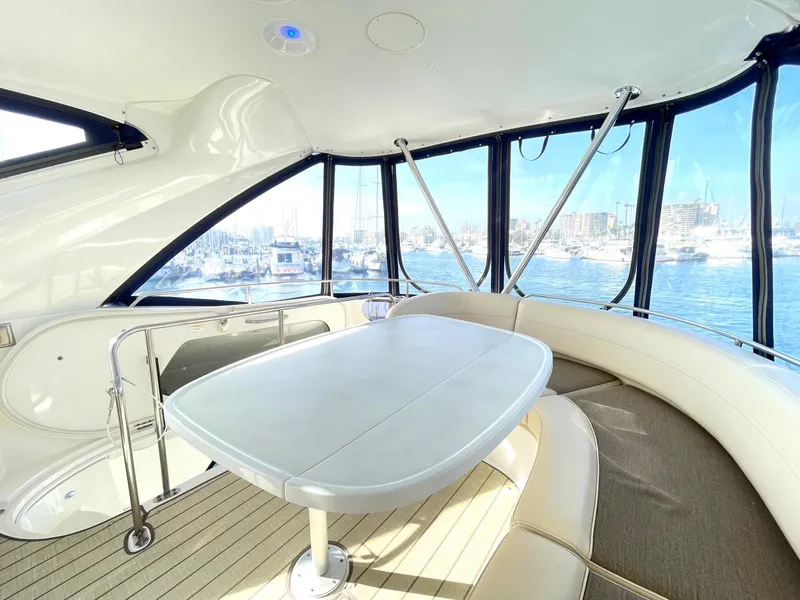 Slide: The Image of Luxurious interior of 2012 Meridian 441 Sedan yacht with panoramic windows and elegant seating. - 43