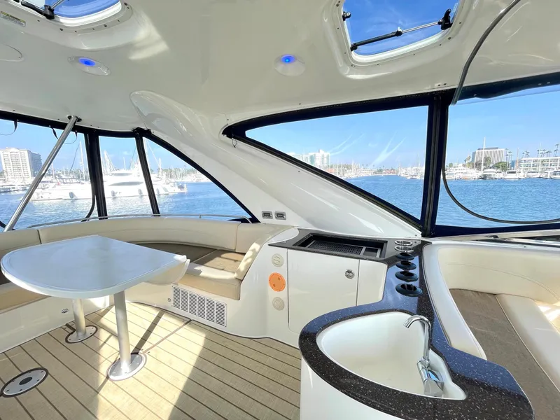 Slide: The Image of Luxurious interior of a 2012 Meridian 441 Sedan yacht with panoramic windows and seating. - 44