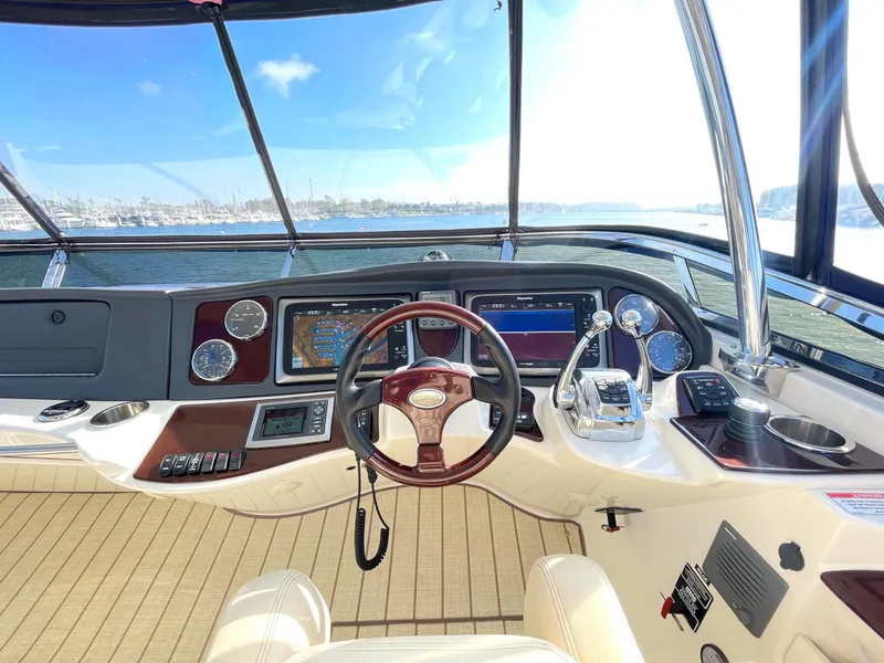 Slide: The Image of 2012 Meridian 441 Sedan helm with modern controls and panoramic water view. - 45